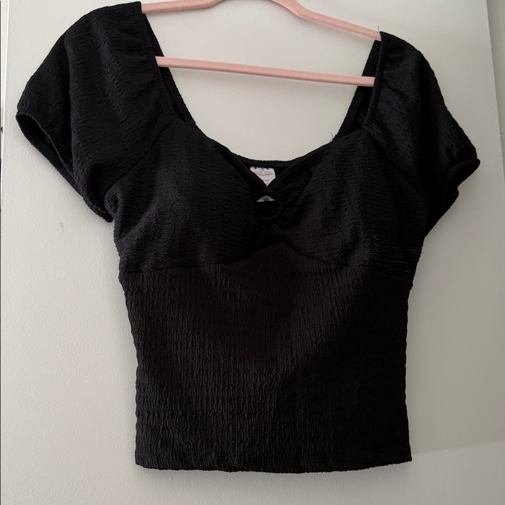 Black going out top